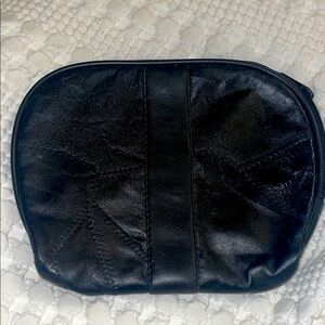 Black Leather Pouch.8” wide by 6 3/4” deep. 
Excellent condition zip closure NEW